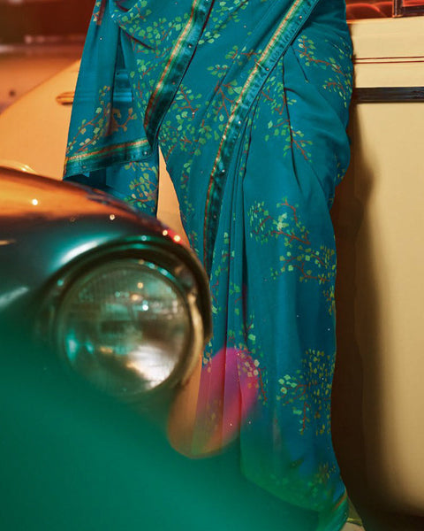 Dark Teal Blue Printed Georgette Saree With Fancy Border